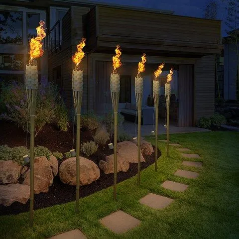 Matney Bamboo Torches - Includes Metal Oil Canisters with Bamboo Covers to Protect from Rain